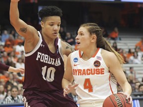 Syracuse's Tiana Mangakahia (4) drives towards the basket as Fordham's Bre Cavanaugh defends during of a first-round game in the NCAA women's college basketball tournament in Syracuse, N.Y., Saturday, March 23, 2019.