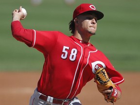 FILE - In this Sept. 16, 2018, file photo, Cincinnati Reds' Luis Castillo pitches against the Chicago Cubs during the first inning of a baseball game in Chicago. Castillo has been picked to start on opening day for the Cincinnati Reds. Rookie manager David Bell made the announcement Tuesday, March 19, 2019, saying Castillo will get the ball March 28 at home against the Pittsburgh Pirates.