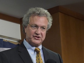 FILE - In this Nov. 29, 2016, file photo, Richard Cohen, president of the Southern Poverty Law Center, right, speaks during a news conference at the National Press Club in Washington. Cohen, the head of the watchdog organization, on Friday, March 22, 2019, announced his resignation to staff. A spokesman for the organization said he could not comment on personnel matters.