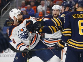 Buffalo Sabres defenseman Rasmus Ristolainen (55) pushes Edmonton Oilers forward Zack Kassian (44) during the first period of an NHL hockey game, Monday, March 4, 2019, in Buffalo N.Y.