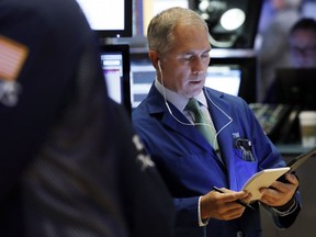 FILE- In this March 18, 2019, file photo trader Timothy Nick works on the floor of the New York Stock Exchange. The U.S. stock market opens at 9:30 a.m. EDT on Thursday, March 28.