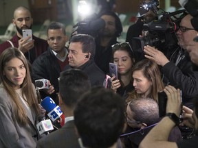 Fabiana Rosales, left, wife of Venezuelan opposition leader Juan Guaido, speaks to reporters before attending Mass at St. Teresa's Church on the Lower East Side of Manhattan, Tuesday, March 26, 2019, in New York. Rosales is emerging as a prominent figure in Guaido's campaign to bring change in the crisis-wracked country.