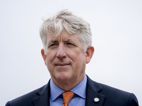 In this Feb. 26, 2018 photo Virginia Attorney General Mark Herring attends a news conference near the White House in Washington. Herring says he's focused on repairing the damage he caused by recently revealing he wore blackface in college, but he hasn't ruled out a future run for governor. Herring made the comments Monday, March 4, 2019 during an interview on the The Kojo Nnamdi Show on WAMU in Washington.