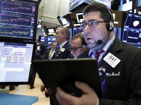 Trader Michael Capolino works on the floor of the New York Stock Exchange, Tuesday, March 5, 2019. Stocks are opening slightly lower on Wall Street led by losses in banks and technology companies.