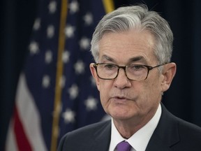 FILE - In this Jan. 30, 2019, file photo, Federal Reserve Chairman Jerome Powell speaks at a news conference in Washington. Powell says political attacks by President Donald Trump played no role in the Fed's decision in January to signal that it planned to take a pause in hiking interest rates. He also said in an interview broadcast Sunday, March 10, 2019, that he can't be fired by the president and that he intends to serve out his full four-year term.