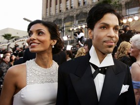 FILE - In this Feb. 27, 2005 file photo, singer Prince arrives with his wife Manuela Testolini for the 77th Academy Awards in Los Angeles. Andra Day, Dave Stewart of the Eurythmics and Philip Bailey of Earth, Wind & Fire will perform during a fundraising gala honoring Prince to benefit the foundation of his second wife, Testolini. The evening Sunday to raise money for In a Perfect World will be hosted by Anthony Anderson. Bobby Brown, Beyonce's mother, Tina Knowles, Chaka Khan and Prince's "Purple Rain" co-star Apollonia Kotero were scheduled to attend. Testolini, who was married to the late megastar from 2001 to 2007, told The Associated Press on Friday that performances will be heavy on Prince music. About 250 people will attend in Los Angeles.