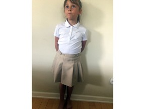 This July 24, 2017, photo provided by Bonnie Peltier shows her daughter A.P., that their home in Winnabow, N.C. Peltier sued her daughter's charter school because it required girls to wear skirts and forbid them from wearing pants. A federal judge ruled on Thursday, March 28, 2019, that Charter Day School's skirts-only rule for girls was unconstitutional sex discrimination.