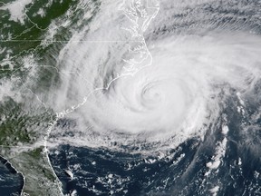 File-This Sept. 14, 2018, file photo shows a satellite image provided by NOAA showing Hurricane Florence on the eastern coast of the United States.  The names of two hurricanes that caused widespread devastation from Florida to Virginia last year have been retired. The National Oceanic and Atmospheric Administration says Florence and Michael will be replaced with Francine and Milton. The new names will first appear during the 2024 Atlantic hurricane season. Names are retired when hurricanes are so destructive that recycling them would be insensitive. Eighty-eight names have been dropped from the list for the Atlantic and Caribbean since storms were first named in 1953. (NOAA via AP, File)