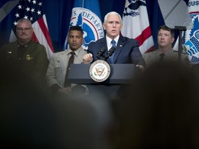 File-This March 13, 2019, file photo shows Vice President Mike Pence speaking to Customs and Border Patrol agents and agents-in-training at the U.S. Customs and Border Protection Advanced Training Facility in Harpers Ferry, W.Va. Pence's visit Thursday, March 21, 2019, to Atlanta included a stop at the Immigration and Customs Enforcement's field office and a conversation about the "broader mission of border security." He also blasted Mayor Keisha Lance Bottoms over her decision last year to bar the city jail from holding federal immigration detainees and thanked the men and women who work for ICE.