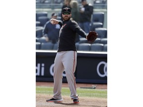Baltimore Orioles first baseman Chris Davis works out prior to an opening day baseball game against the New York Yankees at Yankee Stadium, Thursday, March 28, 2019, in New York.