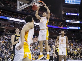 Tennessee's Grant Williams (2) dunks In the second half during a second round men's college basketball game in the NCAA Tournament against Iowa, Sunday, March 24, 2019, in Columbus, Ohio.