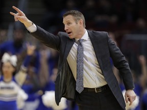 Buffalo head coach Nate Oats yells instruction to players during the first half of an NCAA college basketball game against Akron at the Mid-American Conference tournament, Thursday, March 14, 2019, in Cleveland. Buffalo won 82-46.