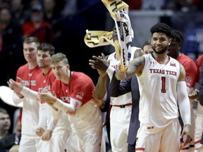 The Texas Tech bench celebrate after a basket during the second half of a first round men's college basketball game against Northern Kentucky in the NCAA Tournament Friday, March 22, 2019, in Tulsa, Okla. Texas Tech won 72-57.