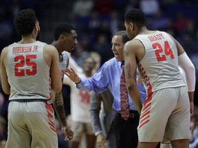 Houston head coach Kelvin Sampson talks to his players during the first half of a first round men's college basketball game against Georgia State in the NCAA Tournament Friday, March 22, 2019, in Tulsa, Okla.