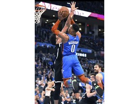 Oklahoma City Thunder guard Russell Westbrook (0) shoots in front of Brooklyn Nets center Jarrett Allen (31) during the first half of an NBA basketball game Wednesday, March 13, 2019, in Oklahoma City.