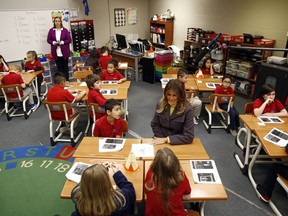 First lady Melania Trump visits with students in a classroom at Dove School of Discovery in Tulsa, Okla., Monday, March 4, 2019, during a two-day, three-state swing to promote her Be Best campaign.