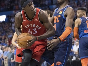 Toronto Raptors forward Pascal Siakam (43) bumps against Oklahoma City Thunder forward Jerami Grant (9) during the first half of an NBA basketball game Wednesday, March 20, 2019, in Oklahoma City.