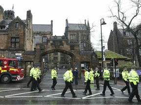 Police and fire services outside the University of Glasgow after the building was evacuated when a suspect package was found in the mailroom, in Glasgow, Scotland, Wednesday March 6, 2019.