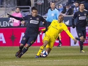 Columbus Crew's Ricardo Clark, right, goes after the ball along with Philadelphia Union's Ilsinho, left, during the first half of an MLS soccer match, Saturday, March 23, 2019, in Chester, Pa.