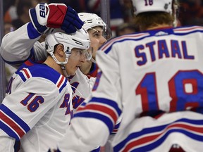 New York Rangers' Ryan Strome (16) is congratulated by teammates after scoring a goal during the first period of an NHL hockey game against the Philadelphia Flyers, Sunday, March 31, 2019, in Philadelphia.