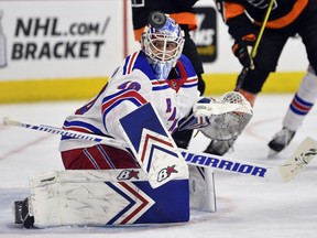 New York Rangers goaltender Alexandar Georgiev looks for the puck after making a save during the second period of an NHL hockey game against the Philadelphia Flyers, Sunday, March 31, 2019, in Philadelphia.