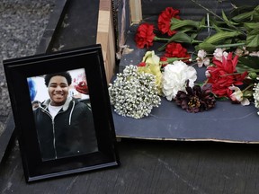 A photo of Antwon Rose II sits with a memorial display for Rose II in front of the Allegheny County courthouse on the second day of the trial for Michael Rosfeld, a former police officer in East Pittsburgh, Pa., Wednesday, March 20, 2019. Rosfeld is charged with homicide in the fatal shooting of Antwon Rose II as he fled during a traffic stop on June 19, 2018.