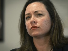 FILE-In this April 24, 2017, file photo, Allegheny County Controller Chelsa Wagner pauses during a press conference at her office in downtown Pittsburgh. Wagner, an elected official from Pittsburgh, and her husband have been charged following an altercation with police in a downtown Detroit hotel. The Wayne County prosecutor's office says Wednesday, March 20, 2019, that 41-year-old Wagner faces felony resisting police and misdemeanor disorderly conduct charges. Wagner's 50-year-old husband, Khari Mosley, is charged with disorderly conduct and disturbing the peace -- both misdemeanors.
