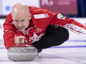 Canada skip Kevin Koe delivers a shot as they face South Korea at the world men's curling championship in Lethbridge on Saturday, March 30, 2019.