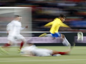 Brazil's Philippe Coutinho jumps to avoid a tackle during the international friendly soccer match between the Czech Republic and Brazil at the Sinobo stadium in Prague, Czech Republic, Tuesday, March 26, 2019.