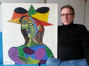 Dutch art detective Arthur Brand poses with stolen Picasso painting Buste de Femme (Dora Maar) on March 14, 2019 at his Amsterdam home.