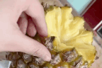A TikTok user demonstrates a hands-on approach to eating pineapple, a great fruit, but not the best fruit, let's be honest. 