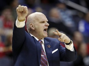 FILE - In this March 10, 2018, file photo Saint Joseph's head coach Phil Martelli directs his team during the first half of an NCAA college basketball semifinal game against Rhode Island in the Atlantic 10 Conference tournament in Washington. Saint Joseph's fired Martelli on Tuesday, March 19, 2019, after 24 seasons. The 64-year-old Martelli became head coach in 1995 after 10 years as an assistant.