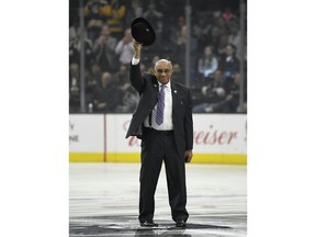 FILE - In this Feb. 22, 2018, file photo, former hockey player Willie O'Ree waves to the crowd after being honored prior to an NHL hockey game between the Los Angeles Kings and the Dallas Stars, in Los Angeles. O'Ree was selected to the Hockey Hall of Fame, Tuesday, June 26, 2018.