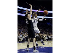 Villanova's Jermaine Samuels (23) goes up for shot against Butler's Nate Fowler (51) during the first half of an NCAA college basketball game, Saturday, March 2, 2019, in Philadelphia.