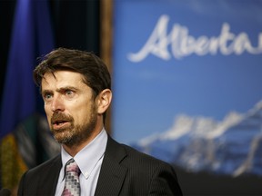 Ed Whittingham answers questions about an update to Alberta's carbon emissions regulations and the creation of an advisory panel to study the province's climate change policy at the media room at the Alberta Legislature in Edmonton, Alta., on Thursday June 25, 2015. Ian Kucerak/Postmedia Network