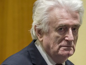 Former Bosnian Serb leader Radovan Karadzic reacts at the court room of the International Residual Mechanism for Criminal Tribunals in The Hague, Netherlands, on March 20, 2019, while waiting to hear the final judgement on his role in the bloody conflict that tore his country apart a quarter of a century ago.