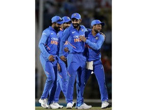 India's Virat Kohli, center, celebrates with teammates after winning the second one-day international cricket match against Australia in Nagpur, India, Tuesday, March 5, 2019.