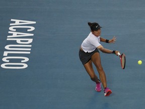 China's Yafan Wang plays a ball in her Mexican Tennis Open final match against Sofia Kenin of the U.S., in Acapulco, Mexico, Saturday, March 2, 2019.