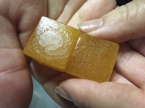 FILE - This Thursday, June 2, 2016 file photo shows lime-flavored cannabis-infused gummy candy in Portland, Ore., on the first day recreational marijuana users could legally purchase marijuana edibles and oils in the state. A study shows marijuana is sending more people to the emergency room in one large Denver hospital. Inhaled weed caused the most severe problems. Marijuana-infused foods and candies also led to trouble.