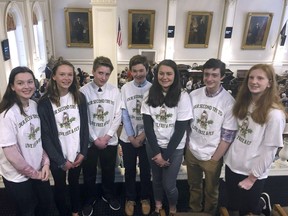 Eighth graders from Hampton Falls, N.H. stand in the gallery of the New Hampshire House on Wednesday, March 20, 2019, in Concord, N.H., ahead of a vote on a bill they drafted to designate the red-tailed hawk as the state's official raptor. The House rejected their bill in 2015 after opponents called the bill unnecessary and the bird too violent. On Wednesday, it voted 333-11 in favor of the bill, which now goes to the Senate.