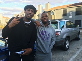 In this Dec. 27, 2018, photo, video blogger Shawn Cotton, left, poses for a portrait with rapper Wayne Walker, who performs under the stage name 30 Rich, after Cotton interviewed Walker for his YouTube channel "Say Cheese TV," in Fort Worth, Texas. The killing of Zack Stoner, a pioneer in a new genre of news in which videographers interview street gangs and rappers in high-crime areas, has unnerved other gangland reporters nationwide, including Cotton.