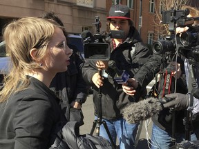 Chelsea Manning addresses the media outside federal court in Alexandria, Va., Tuesday, March 5, 2019. The former Army intelligence analyst says a judge rejected her effort to quash a grand jury subpoena to testify in an apparent investigation of Wikileaks.