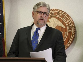 Bryan Schroder, Alaska's U.S. Attorney announces that several members of a white supremacist gang operating in Alaska prisons or shipped to facilities in Colorado and Arizona, have been charged in a racketing enterprise in Anchorage, Alaska, Wednesday, March 27, 2019. Members who sport Nazi tattoos face racketeering charges including murder, kidnapping, assault, and distribution of narcotics and firearms.