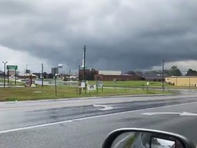 This photo provided by Greg Martin shows a funnel cloud in Byron, Ga., Sunday, March 3, 2019. The National Weather Service on Sunday issued a series of tornado warnings stretching from Phenix City, Alabama, near the Georgia state line to Macon, Georgia, about 100 miles (160 kilometers) to the east.