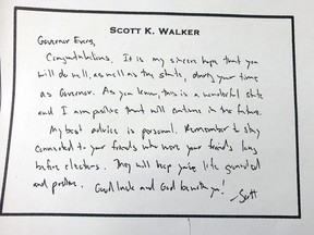 This March 4, 2019 photo shows a hand written note that former Wisconsin Gov. Scott Walker left for his successor, Tony Evers just before he left office in January. Evers on Monday released the note after initially refusing an Associated Press open records request for the document.