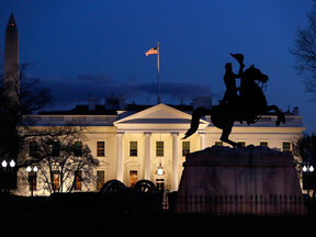 The White House is seen at dusk, March 22, 2019, in Washington. Special counsel Robert Mueller has concluded his investigation into Russian election interference and possible coordination with associates of President Donald Trump.