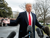 President Donald Trump talks with reporters before boarding Marine One on the South Lawn of the White House, March 22, 2019, in Washington.