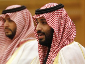 In this Feb. 22 2019, file photo, Saudi Crown Prince Mohammad bin Salman, right, speaks to Chinese President Xi Jinping during a meeting at the Great Hall of the People in Beijing.