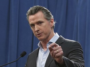 EMBARGO HOLD FOR RELEASE FOR PUBLICATION ON WEDNESDAY, MAR. 13, AND THEREAFTER - FILE - In this Monday Feb. 11, 2019 file photo Calif. Gov. Gavin Newsom answers questions at a Capitol news conference, in Sacramento, Calif. Newsom is expected to sign a moratorium on the death penalty in California Wednesday, March 13, 2019.
