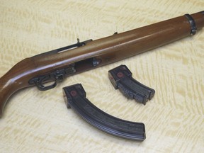 FILE -- In this June 27, 2017 photo, a semi-automatic rifle is displayed with a 25 shot magazine, left, and a 10 shot magazine, right, at a gun store in Elk Grove, Calif. San Diego-based U.S. District Judge Roger Benitez declared, Friday March 29, 2019, unconstitutional the law banning possession of magazines containing more than 10 bullets. California law has prohibited buying or selling the magazines since 2000, but has allowed those who had them to keep them.